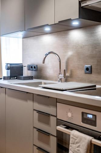 a kitchen with a sink and a counter top at Appartements Perberschlager in Oetz