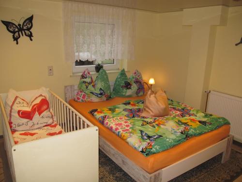 two twin beds in a room with butterfly pillows at Apartment Bismarcksberg by Interhome in Alt Schönau