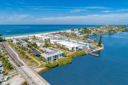 an aerial view of a resort next to the ocean at Absolute Anna Maria-Private Beach Access-Heated Pool-Water Views From Every Room in Bradenton Beach