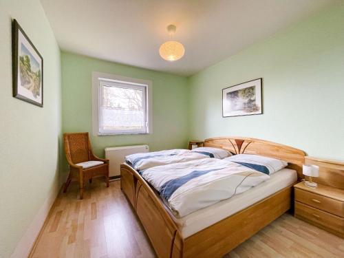 Tempat tidur dalam kamar di Holiday Home Konrad by Interhome