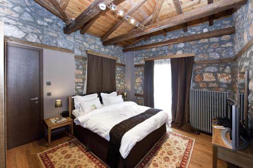 Letto o letti in una camera di Miramonte Chalet Hotel Spa