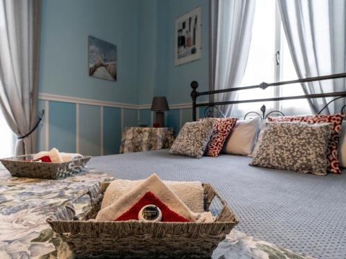a bedroom with a bed with baskets on it at Holiday Home Margherita by Interhome in Dolceacqua