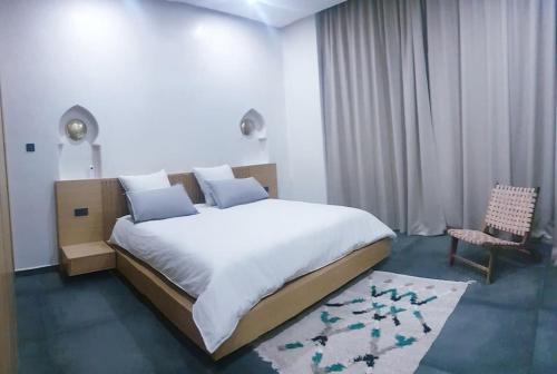 Säng eller sängar i ett rum på Villa Marrakech