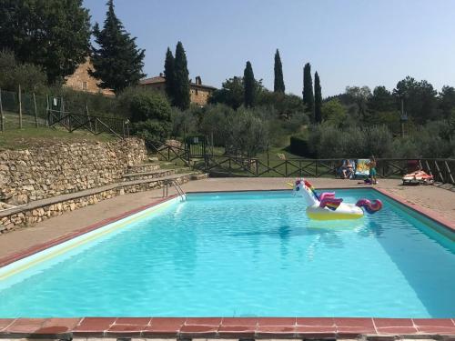 a swimming pool with a raft in the water at Holiday Home Casa Patrizia by Interhome in Monsanto