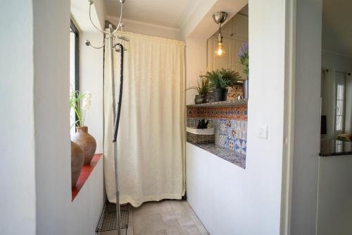 a hallway with a shower curtain in a home at Casa Ancladero Big rooftop terrace, 2 bedroom guesthouse w garden and view in Fuengirola