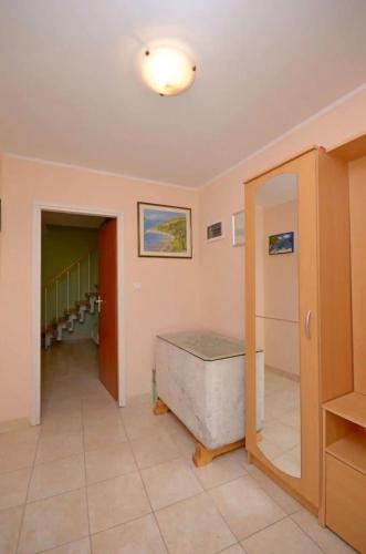 a room with a bath tub and a hallway at House Marija in Lastovo
