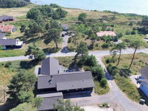 an aerial view of a building next to the ocean at Holiday Home Ansgar - all inclusive - 150m from the sea in Bornholm by Interhome in Vester Sømarken