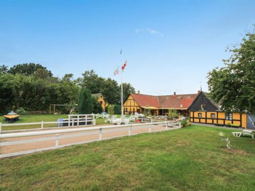 a house with a large yard and a building at Apartment Annamia - 250m from the sea by Interhome in Neksø
