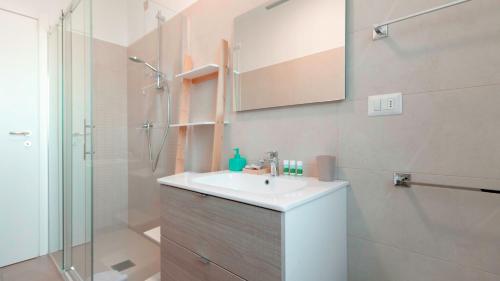 a bathroom with a sink and a shower at Italianway - Brianza 14 A in Milan