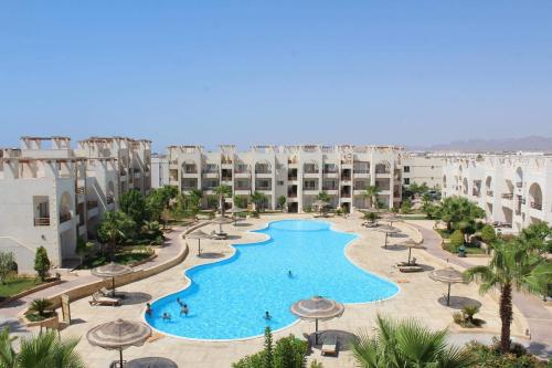 an aerial view of a swimming pool in a resort at Sunny Lakes Resort , Revira Apartment in Sharm El Sheikh