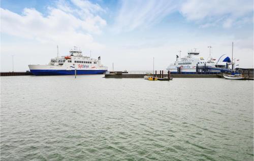 two large ships docked at a dock in the water at Nice Home In Rømø With Wifi in Toftum