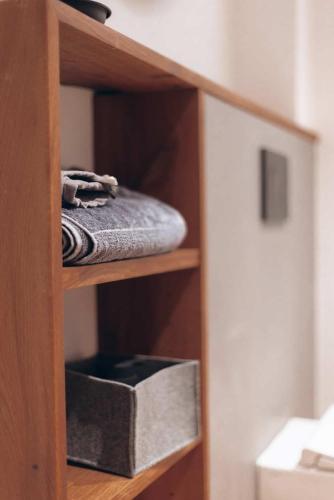 a wooden shelf with a box on top of it at Eifel 2.0 in Bad Münstereifel