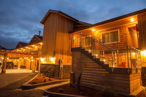 a building with a staircase with lights on it at Pelican Shores Inn in Lincoln City