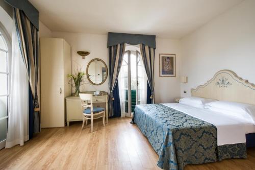 Postel nebo postele na pokoji v ubytování Hotel Goya