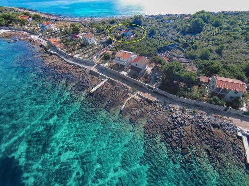 an aerial view of a resort and the ocean at House Frane in Drvenik Mali
