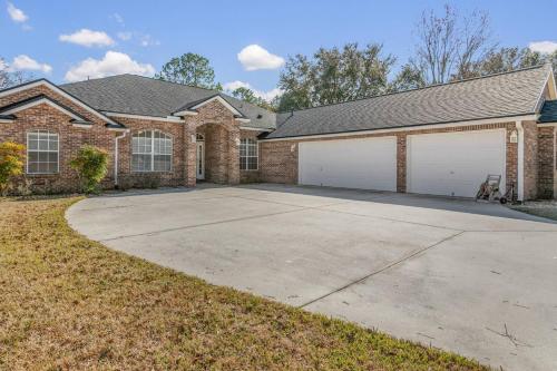 a brick house with two garage at Sunset Pass in Middleburg