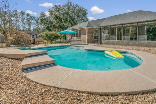 a swimming pool with a raft in the middle at Sunset Pass in Middleburg