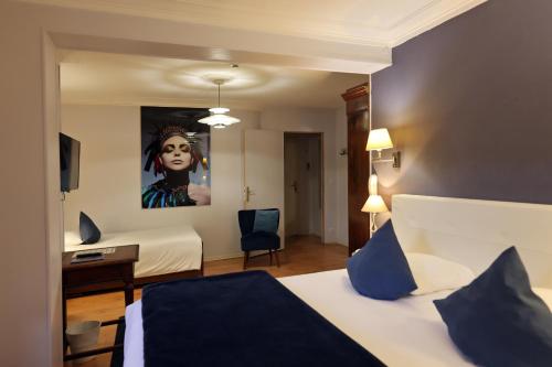 Katil atau katil-katil dalam bilik di Hotel Les Pasteliers