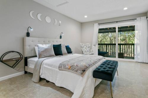 a bedroom with a large bed and a window at The Den at The Ravines in Middleburg