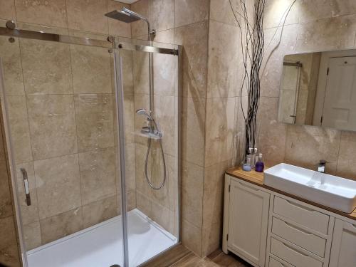 a bathroom with a shower and a sink at Parliament Sq apt 12 Royal Mile in Edinburgh