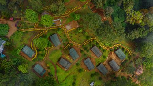 an overhead view of a park with trees and a road at Nature Zone Jungle Resort in Munnar