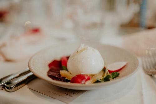 a plate of food with ice cream on a table at The Zetter Clerkenwell in London