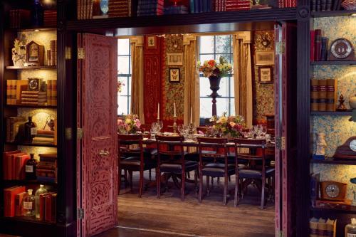 a dining room with a long table and chairs at The Zetter Clerkenwell in London