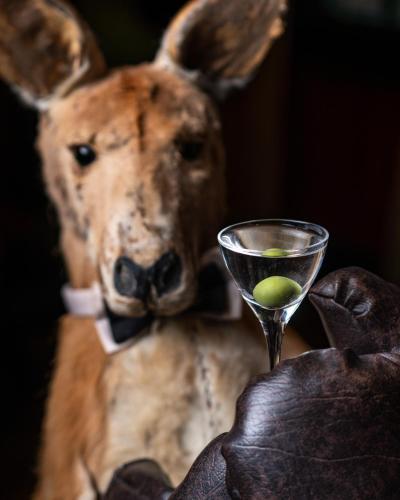 a deer holding a martini glass with a lime in it at The Zetter Clerkenwell in London