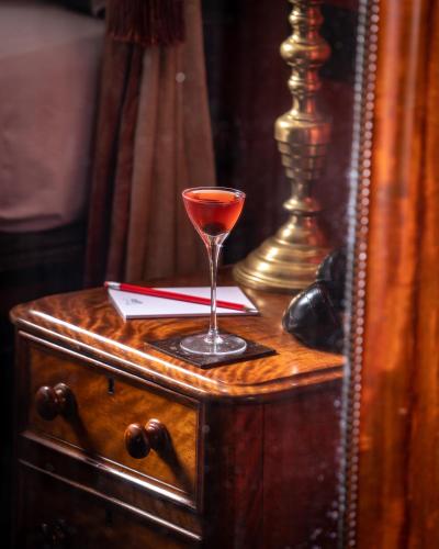 a drink in a wine glass sitting on a table at The Zetter Clerkenwell in London