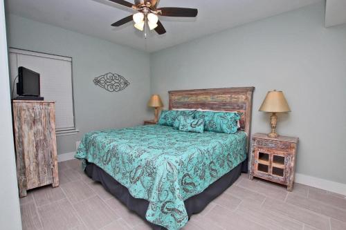 a bedroom with a bed and a ceiling fan at Phoenix X 1208 in Orange Beach