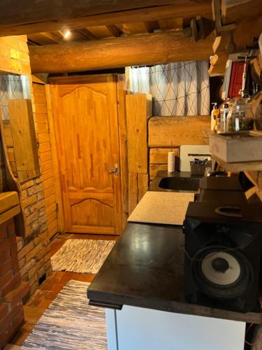 a kitchen with a sink and a counter top at Pirtiņa in Ogre