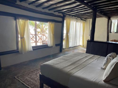 Cama o camas de una habitación en Sivana Tulum