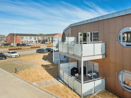 a building with a balcony on the side of it at Apartment Aiana - 250m from the sea by Interhome in Ringkøbing