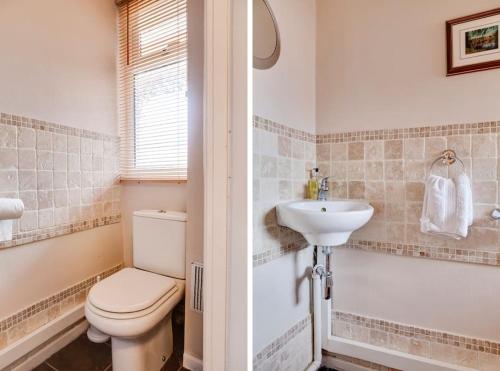 a bathroom with a toilet and a sink at Cosy 3 Bed in the heart of Chester in Chester