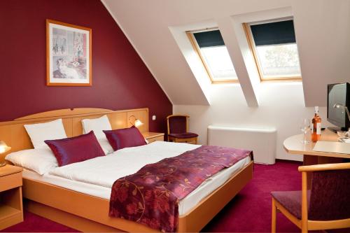 Voodi või voodid majutusasutuse Hotel Kálvária toas