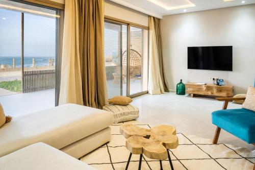 a living room with a view of the ocean at Tulum Beach Resort Dakhla in Dakhla