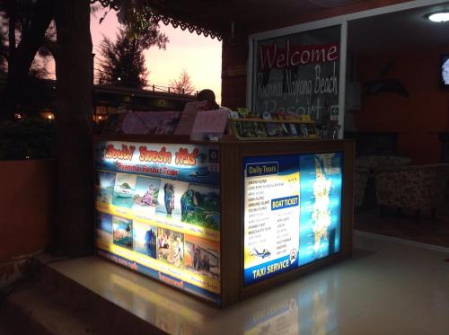 a welcome sign in front of a store at Ruan Mai Naiyang Beach Resort in Nai Yang Beach