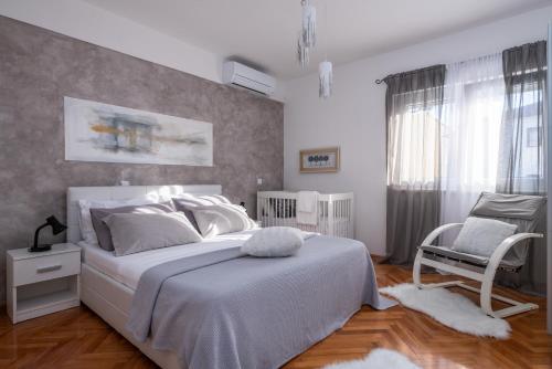 Postel nebo postele na pokoji v ubytování Villa Daniel