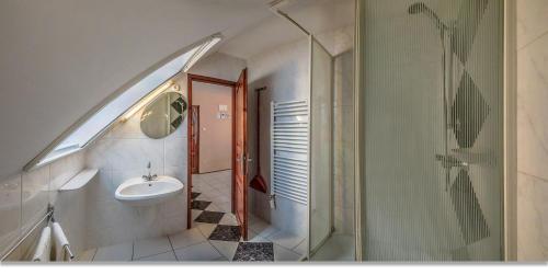 a bathroom with a sink and a shower at Laky Villa Zalakaros in Zalakaros
