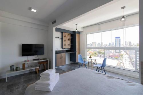 Ένα ή περισσότερα κρεβάτια σε δωμάτιο στο Contemporary Studio - GRU 1103