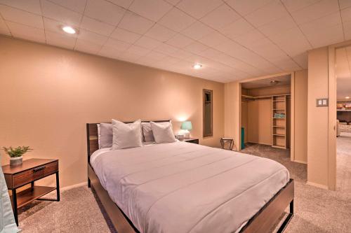 a bedroom with a large bed in a room at Arvada Home with Deck and Game Room Near Olde Town! in Arvada