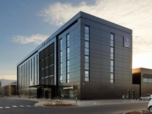 a large black building with a lot of windows at Village Hotel Edinburgh in Edinburgh