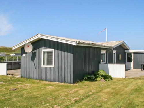 a house with a frisbee on the side of it at Holiday Home Thurid - 200m from the sea in NW Jutland by Interhome in Løkken