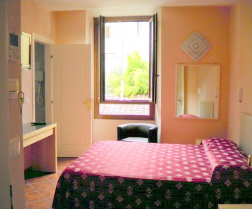 Postel nebo postele na pokoji v ubytování Hotel Rita Major