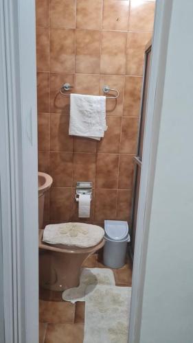 a small bathroom with a toilet and a sink at HOSTEL SANTOS PRAIA in Santos
