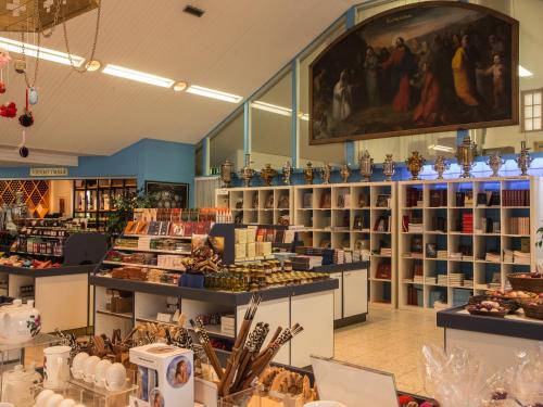 a store filled with lots of items on display at Valamon Luostari in Uusi-Valamo