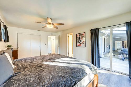 a bedroom with a bed and a ceiling fan at Dog-Friendly Oakhurst Home Walk to Downtown! in Oakhurst