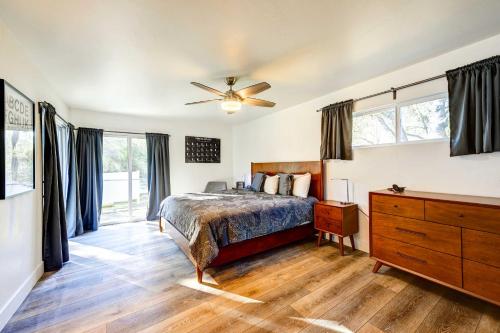 a bedroom with a bed and a ceiling fan at Dog-Friendly Oakhurst Home Walk to Downtown! in Oakhurst