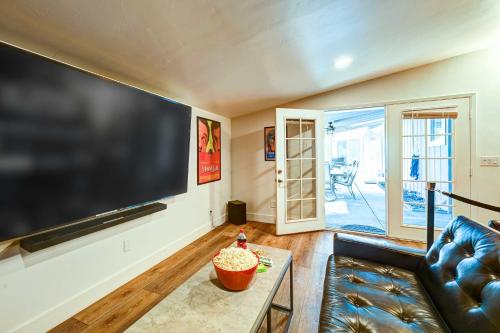 a living room with a large flat screen tv at Dog-Friendly Oakhurst Home Walk to Downtown! in Oakhurst