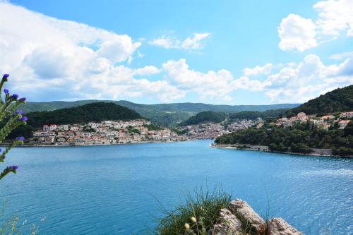 a view of a river with a town in the distance at Apartments Sonja in Pučišća
